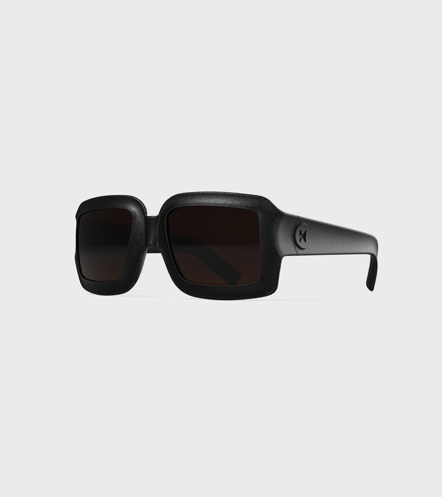 Stylish black square sunglasses with dark lenses for a refined and modern aesthetic