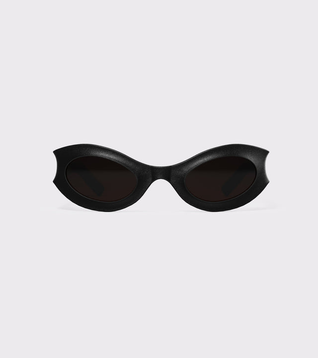 Bold black cat-eye eyewear with sculpted frames, perfect for a sleek, statement-making look