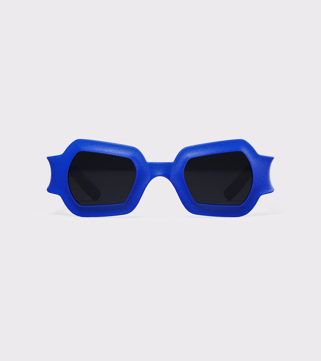 Bold blue 3D printed sunglasses with unique geometric frames and dark lenses, designed for an excellent fit across different nose profiles