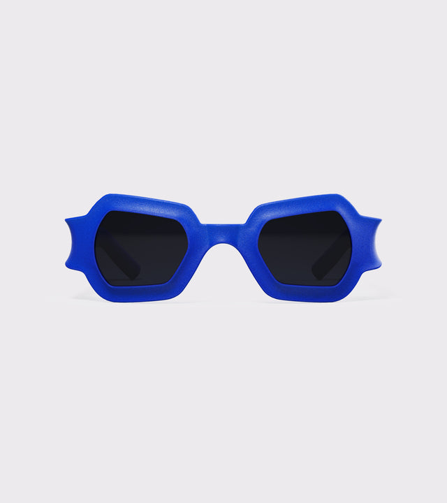 Bold blue 3D printed sunglasses with unique geometric frames and dark lenses, designed for an excellent fit across different nose profiles