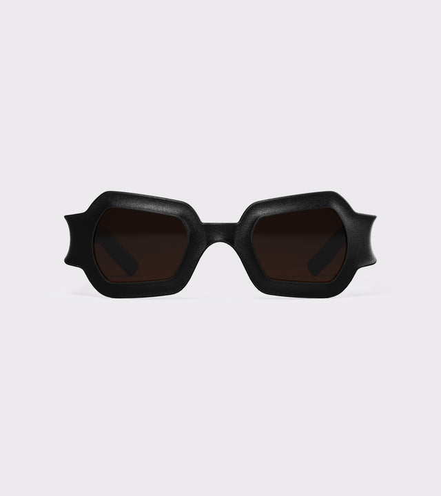 Bold black 3D printed sunglasses with unique geometric frames and dark lenses, designed for an excellent fit across different nose profiles