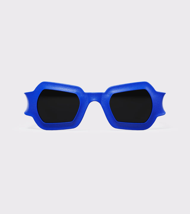 Bold blue 3D printed sunglasses with unique geometric frames and dark lenses, designed for an excellent fit across different nose profiles