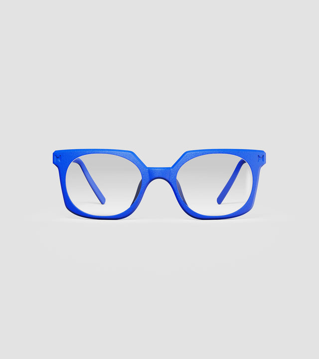 Bold blue square-frame glasses with clear lenses, designed with an inclusive fit for all nose bridges, featuring a modern minimalist design.